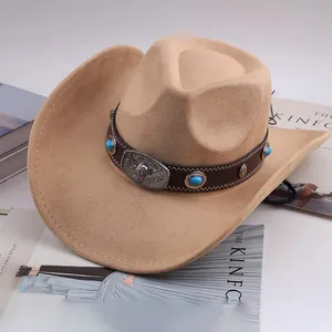 Close-up of a khaki Western cowboy hat featuring decorative turquoise and bull head emblem