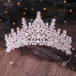 Detailed close-up of a sparkling silver rhinestone tiara for bridal wedding dress
