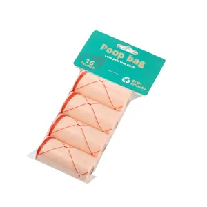 Detail shot of 4-roll pack of peach biodegradable pet poop bags with red bone pattern.