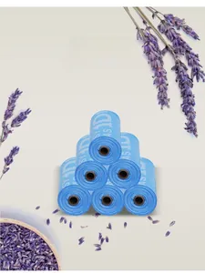 Detail of lavender scented blue dog poop bags with floral background