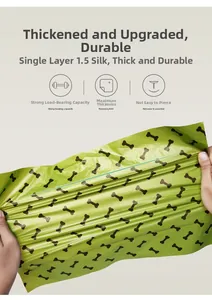 Close-up of green pet waste bag being stretched to show durability and thickness