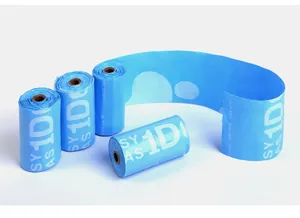Detailed view of bright blue biodegradable dog waste bag rolls featuring easy tear lines.