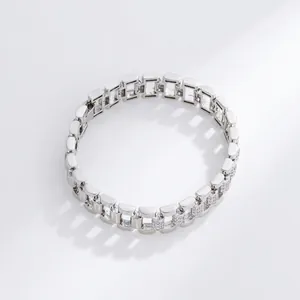 Detailed close-up of a silver-tone watch link bracelet with cubic zirconia stones.