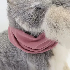 Detail view of soft pink elastic dog snood for grooming and noise reduction.