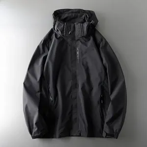 Detailed front view of a black waterproof outdoor hooded jacket for men and women
