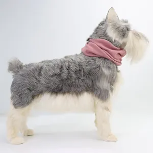 Side detail of soft pink dog ear muffs snood for noise reduction on a pet model