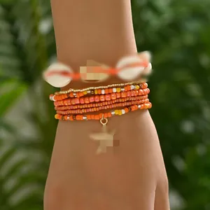 Close-up detail of Bohemian 7-piece bead bracelet set with shell and starfish charms