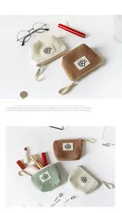 Macro view of waffle-patterned cosmetic and earphone storage pouches in various colors