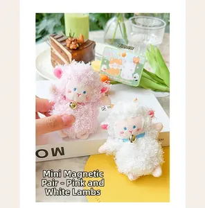 Close-up detail showing mini magnetic plush lamb keychains in cute pink and white colors
