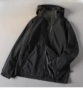 Black waterproof outdoor jacket with hood and functional techwear style zip pockets