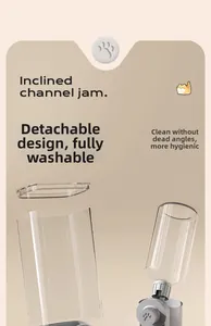 Detail view of the detachable transparent tank and bottle parts of an automatic pet waterer