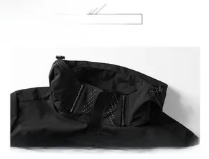 Close-up detail of the windproof stand collar on a black outdoor hiking jacket.