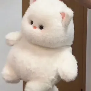 Close-up of a cute fluffy white cat plush toy with a soft texture and adorable face.
