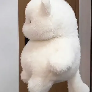 Macro view of fluffy white cat plush toy showing the soft long hair texture and round body