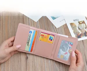 Detailed internal view of a pink minimalist short bifold wallet with card slots