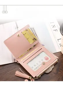 Interior detail of pink bi-fold wallet with card slots and zipper coin pocket