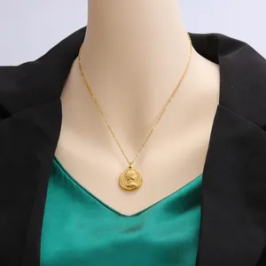 Detailed view of 18k gold plated stainless steel coin necklace on a mannequin.