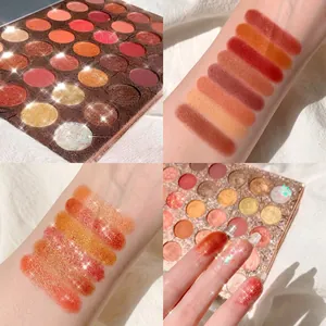 Close-up detail of 35-color earth tone eyeshadow palette with glitter texture swatches.