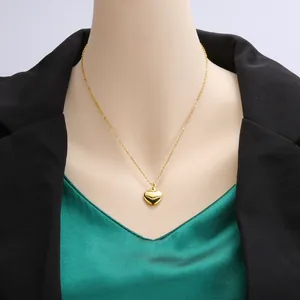 Elegant 18k gold plated stainless steel heart pendant necklace displayed on mannequin