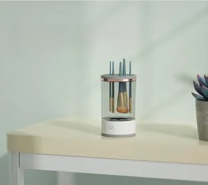 Electric automatic makeup brush cleaner and dryer shown in a dust-proof storage setup