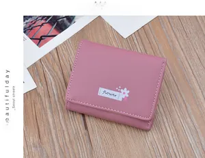 Elegant small pink tri-fold wallet for women featuring soft faux leather and flower print