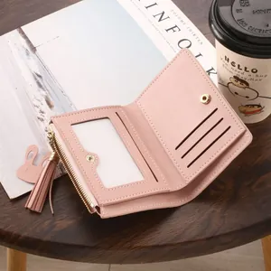 Minimalist slim pink bifold wallet for women featuring zipper pocket and elegant tassel detail