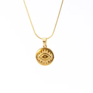 Close-up of 18k gold plated stainless steel necklace with evil eye sun pendant