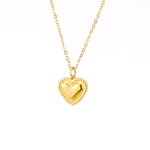 Close-up of a delicate 18k gold plated heart pendant necklace on a plain white background.