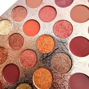 Macro detail of a 35-color eyeshadow palette featuring matte and shimmer textures.