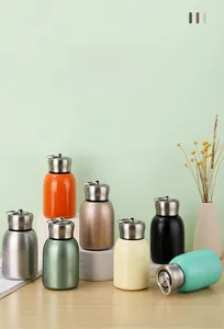 Collection of mini colorful vacuum insulated stainless steel cups with carry rings
