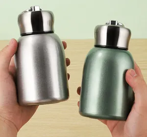 Macro view of portable mini 304 stainless steel insulated vacuum flasks with carrying loops