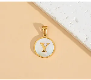 Detailed close-up view of a minimalist stainless steel gold circle pendant with letter Y.