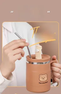 Close-up of brown stainless steel mug with cute bear and multifunctional lid