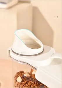Close-up detail showing the U-shaped funnel spout on a pet food storage container