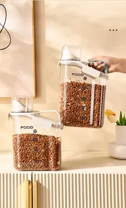Detail view of pet food storage container with ergonomic handle and measuring cup
