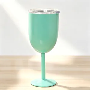 Detail view of mint green insulated stainless steel wine goblet with clear leak-proof lid