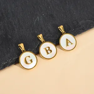 Minimalist gold plated stainless steel initial pendants with white shell inlay for women.