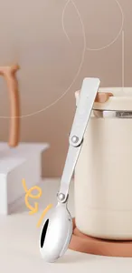 Detailed view of a foldable 304 stainless steel stirring spoon for a modern coffee mug