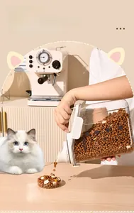 Action shot of pouring kibble from a clear airtight pet food storage container
