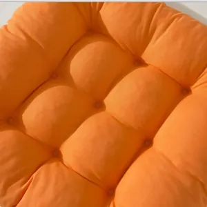 Soft orange brushed fabric chair cushion with tufted square design for home office chairs