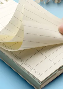 Macro view of portable English vocabulary notebook pages showing high-quality paper texture