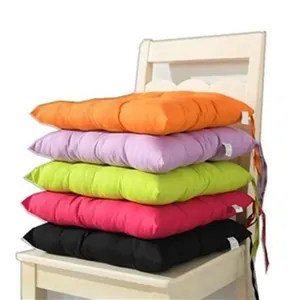 Vibrant stack of solid color brushed fabric chair cushions for office and dining use.