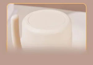Detail view showing the non-slip and silent bottom of this cream-colored mug