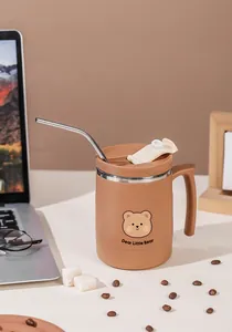 Detailed close-up of brown stainless steel coffee mug with bear design and straw