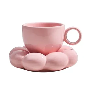 Pink ceramic coffee cup and saucer set with creative flower petal design for afternoon tea