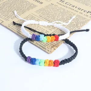 Handmade rainbow knot braided bracelets in black and white with adjustable cord.