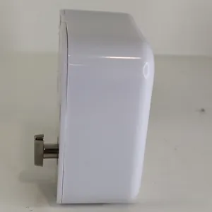 Vista lateral detallada de un mecanismo de cuerda para caja de música blanca de plástico