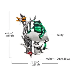 Detailed view of frog and mushroom brooch showing 4.6cm height and weight info.