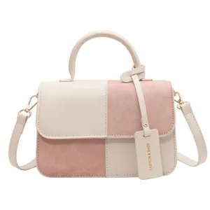 Elegant color-block crossbody bag with flap and top handle in beige and pink finish