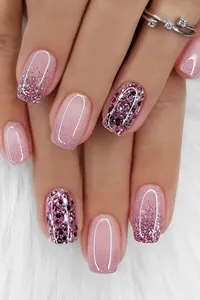 Detailed view of pink gradient press-on nails with purple glitter and square shape design.